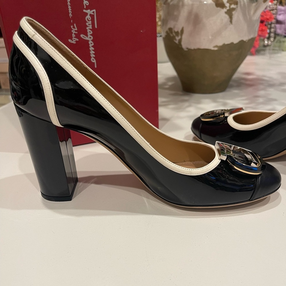 Salvatore Ferragamo pumps, black, ivory trim,gold and silver buckle size 10